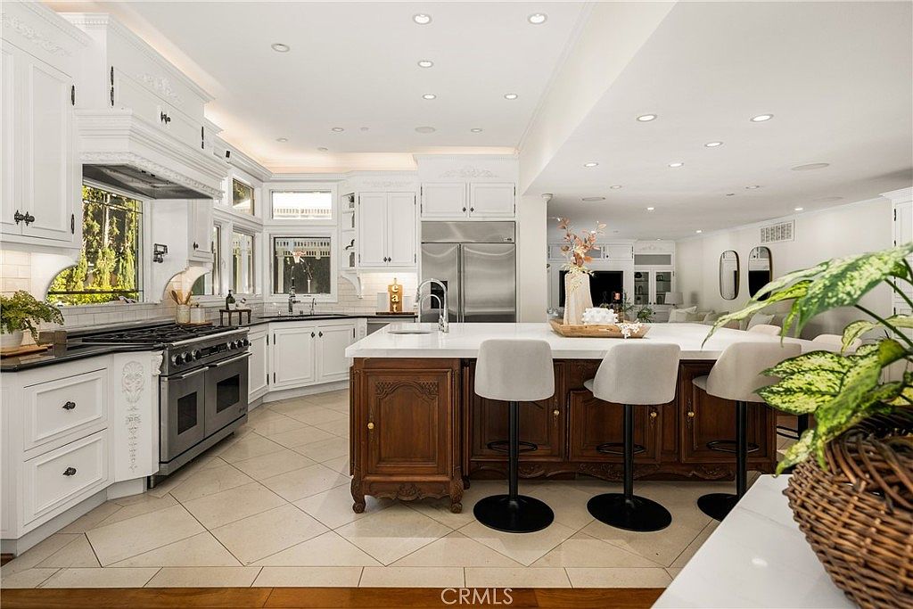 Chef's kitchen with oversized center island and professional appliances